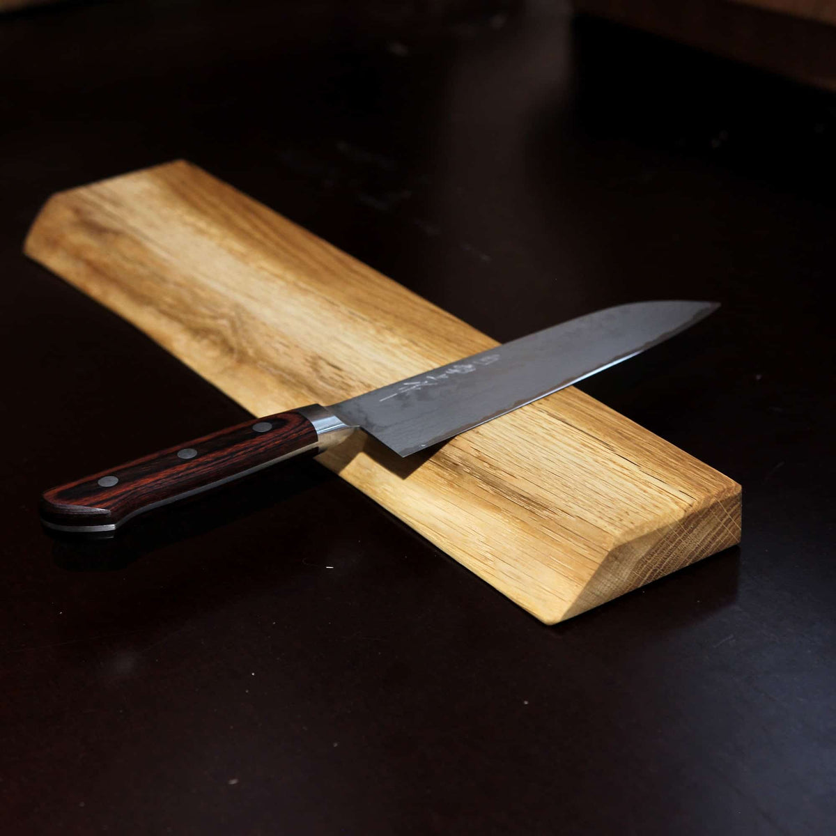 A magnetic knife rail made from solid oak