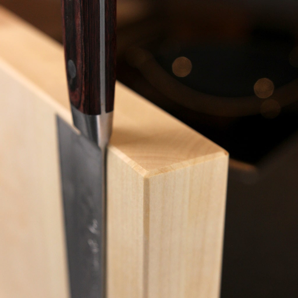 A magnetic knife block made from solid maple