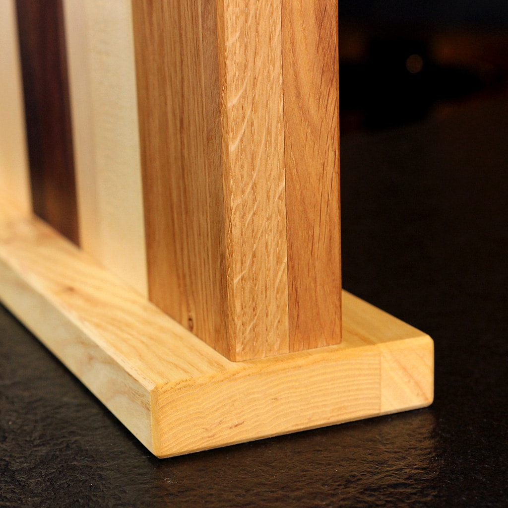 Wooden base detail of a handcrafted Birch, Oak and Walnut Magnetic Knife Block
